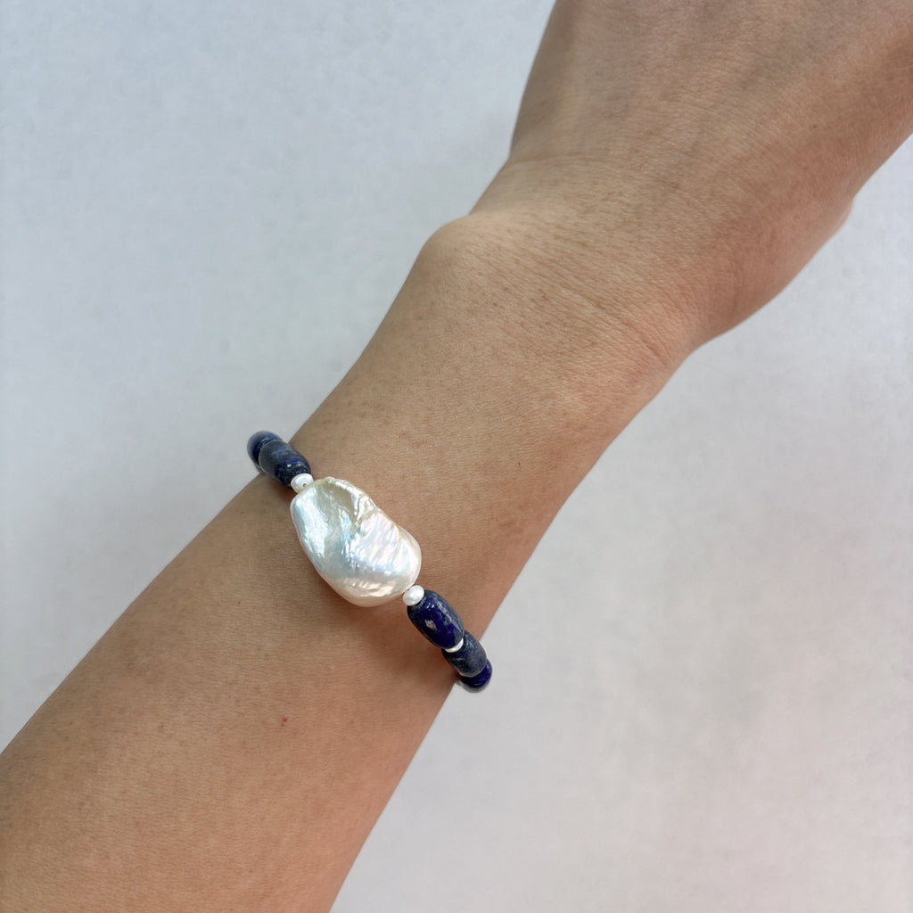 Model wearing Blue Horizon Lapis Lazuli & Baroque Pearl Bracelet