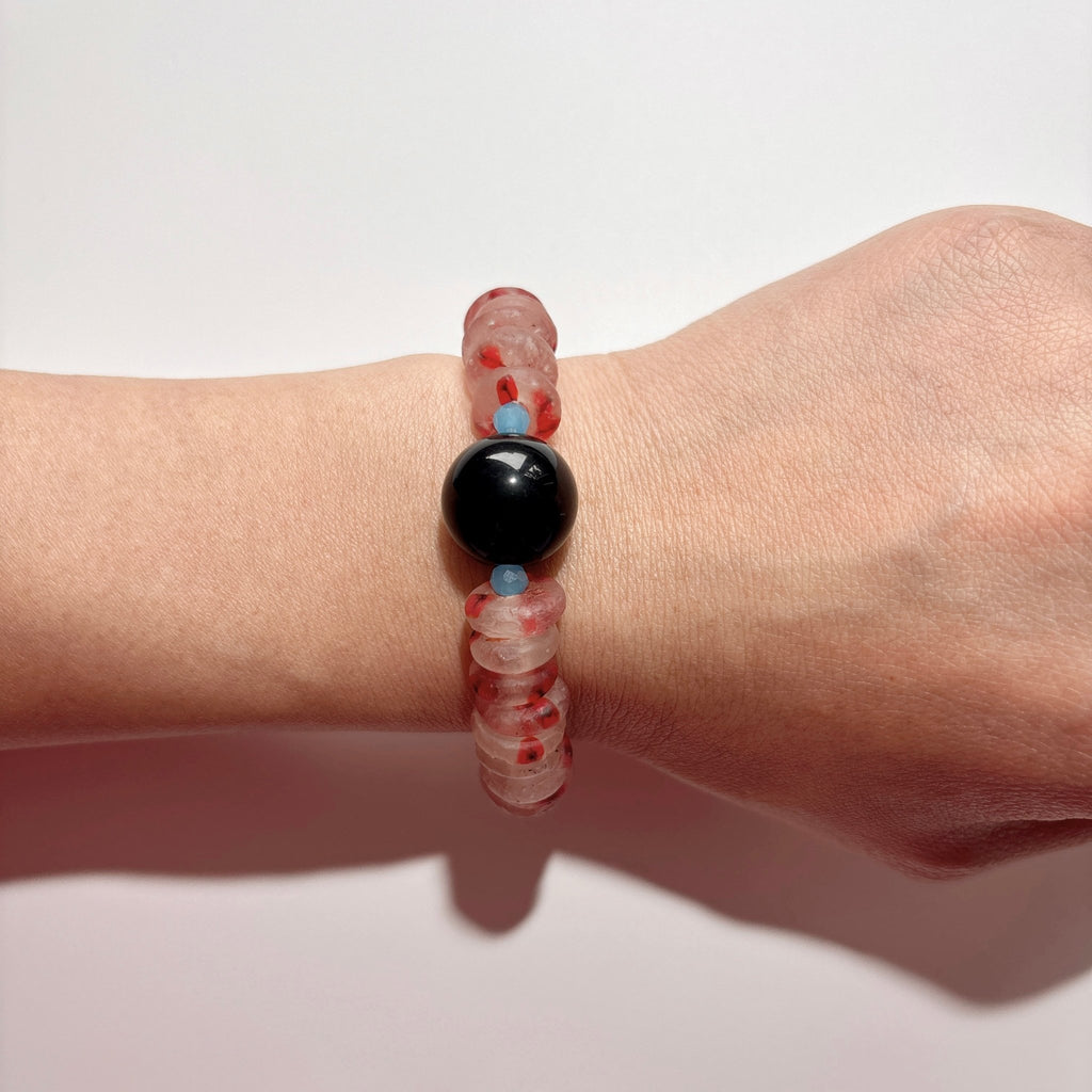 Model wearing First Bloom Red Glass & Black Agate Bracelet