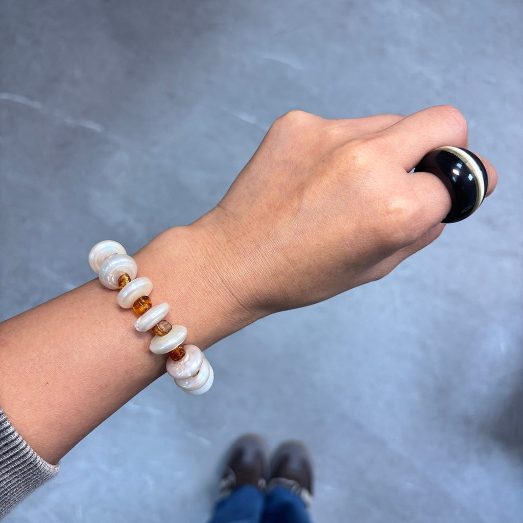 Model wearing Golden Amber Freshwater Pearl & Amber Bracelet