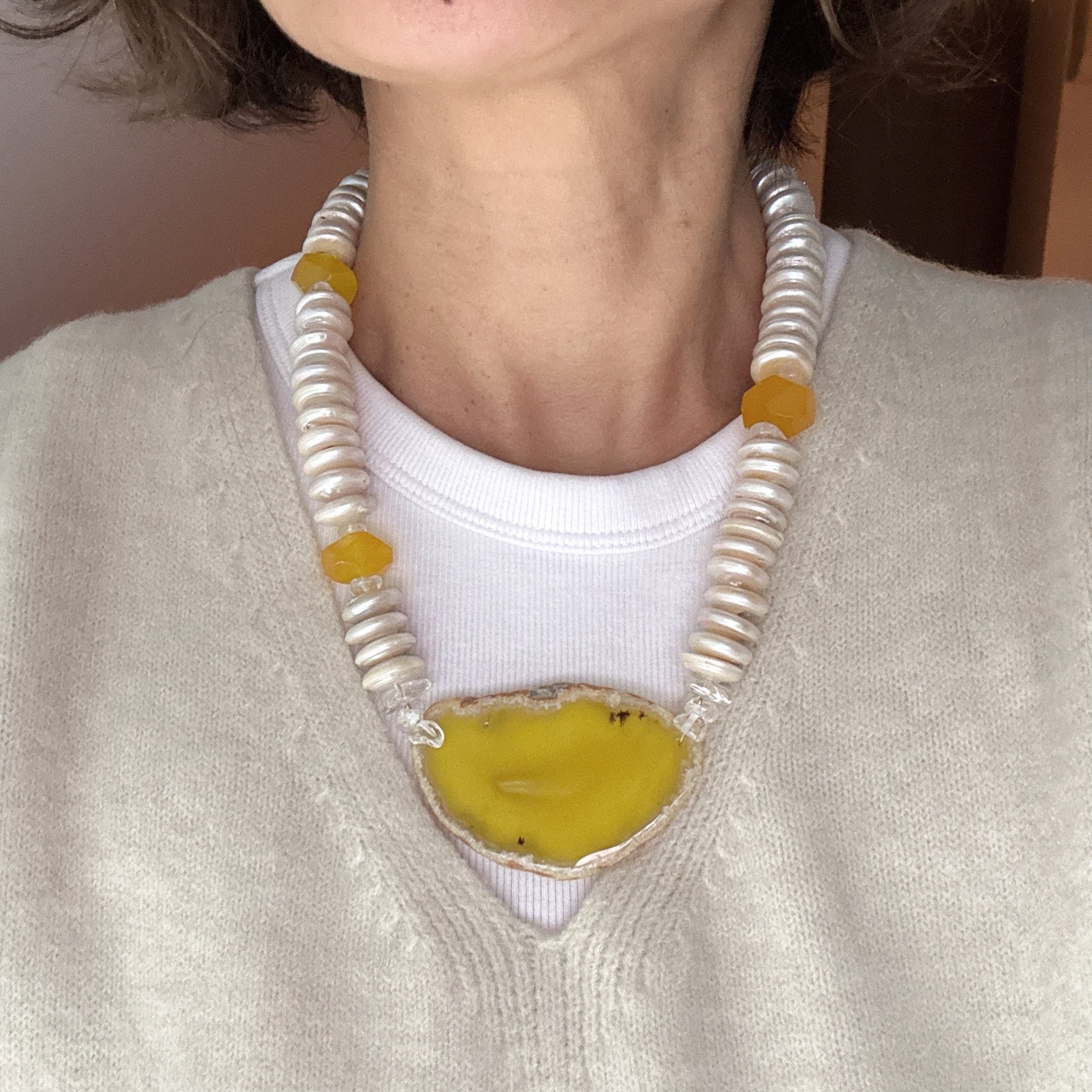 Model wearing Golden Horizon Freshwater Pearl & Agate Slice Necklace