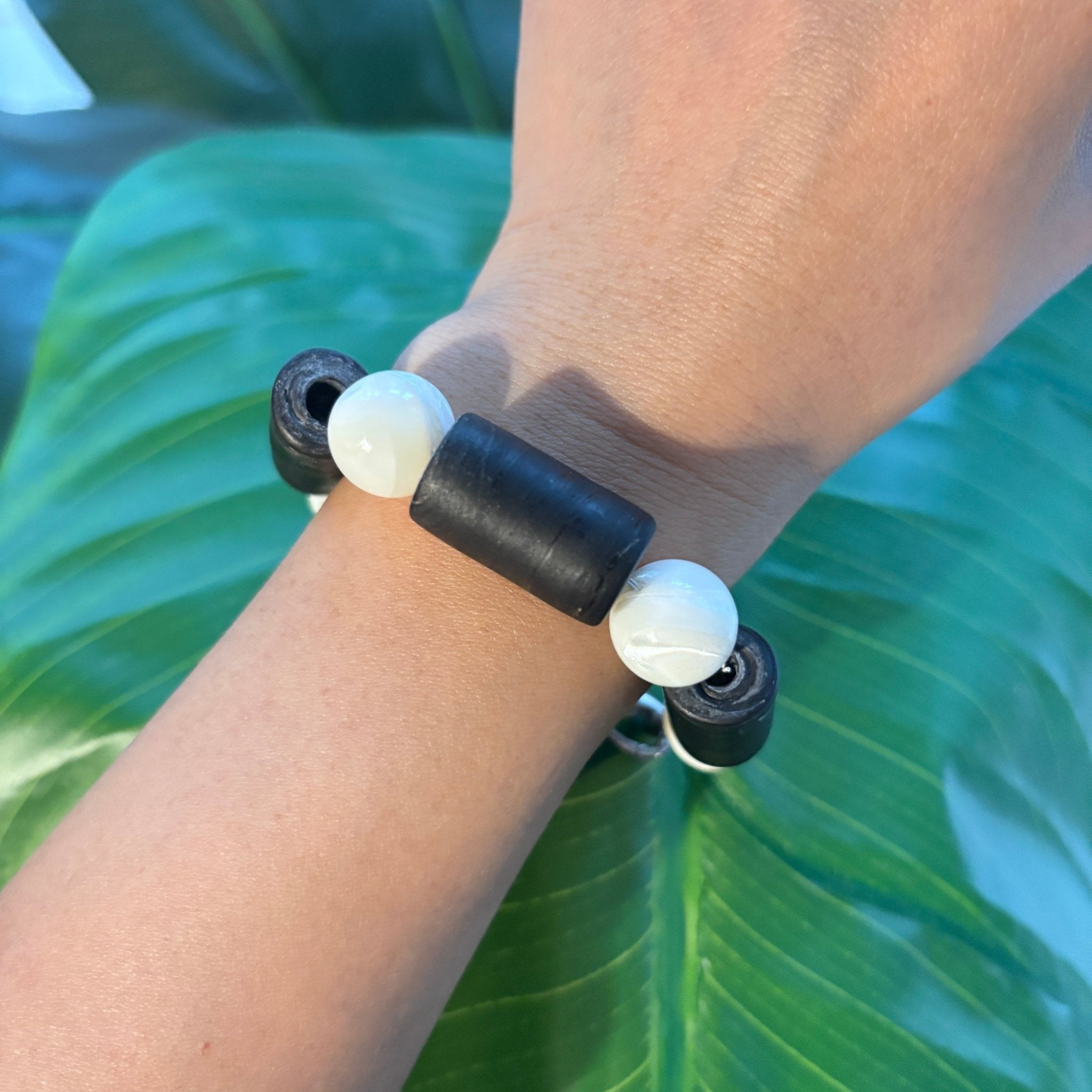 Model wearing Midnight Coast Nepalese Glass and Trochus Shell Bracelet