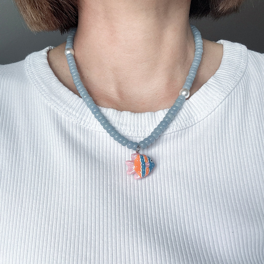 Model weating Ocean Fish Charm Necklace