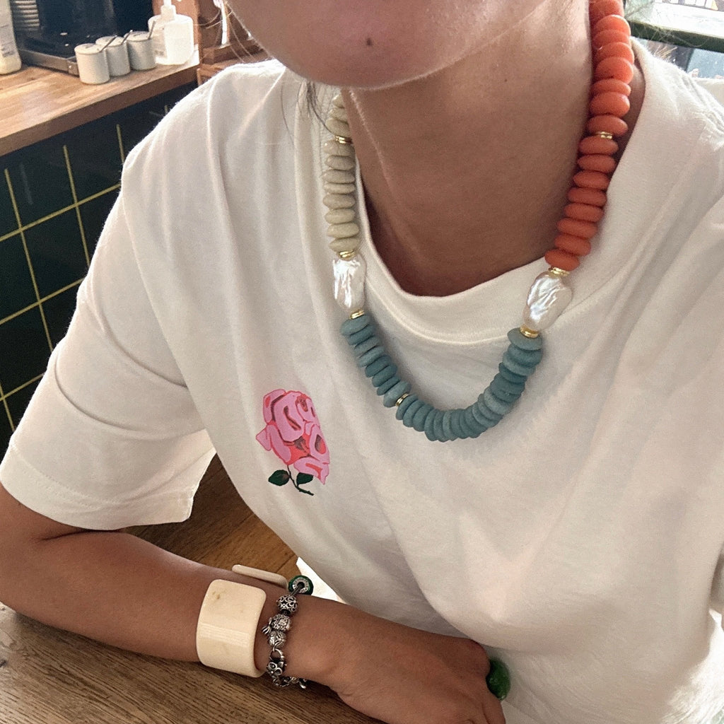 Model wearing Sunset Carnival Glass Bead & Baroque Pearl Necklace